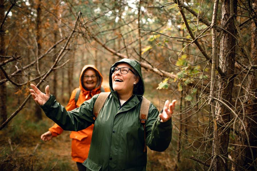 Mature Women walking in forest